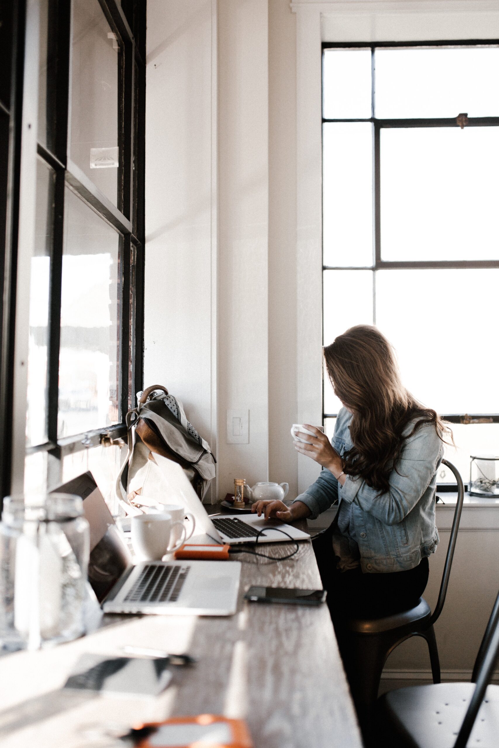 Businesswoman working in an office using technology solutions supported by TLD USA for improved productivity and digital growth.
