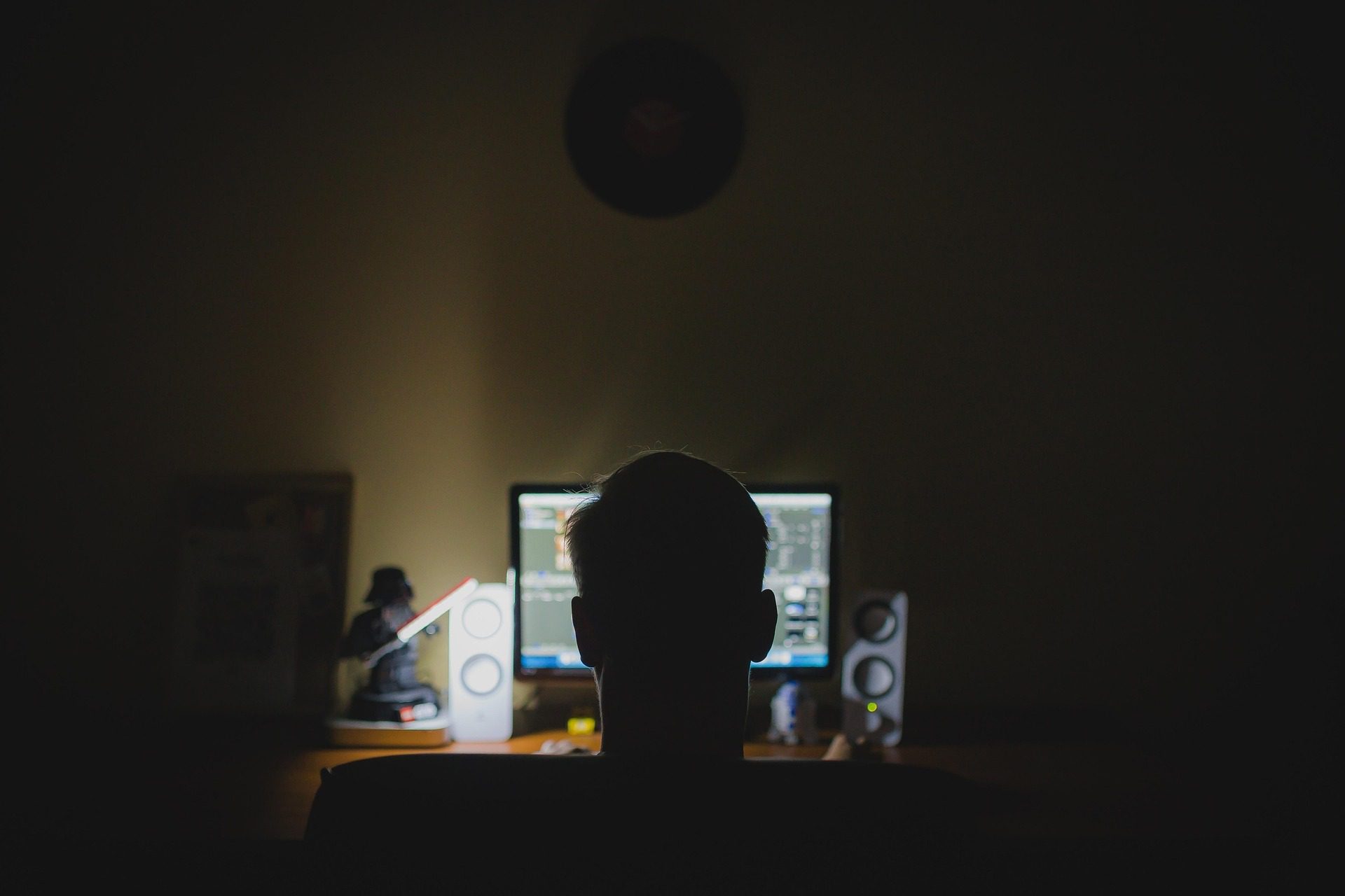 Business professional working late on a computer representing reliable technology support and IT services.