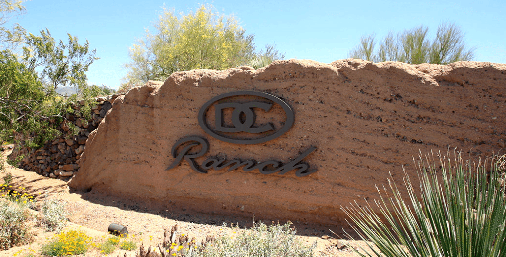 Stone entrance sign for DC Ranch community in North Scottsdale Arizona near Thompson Peak Parkway