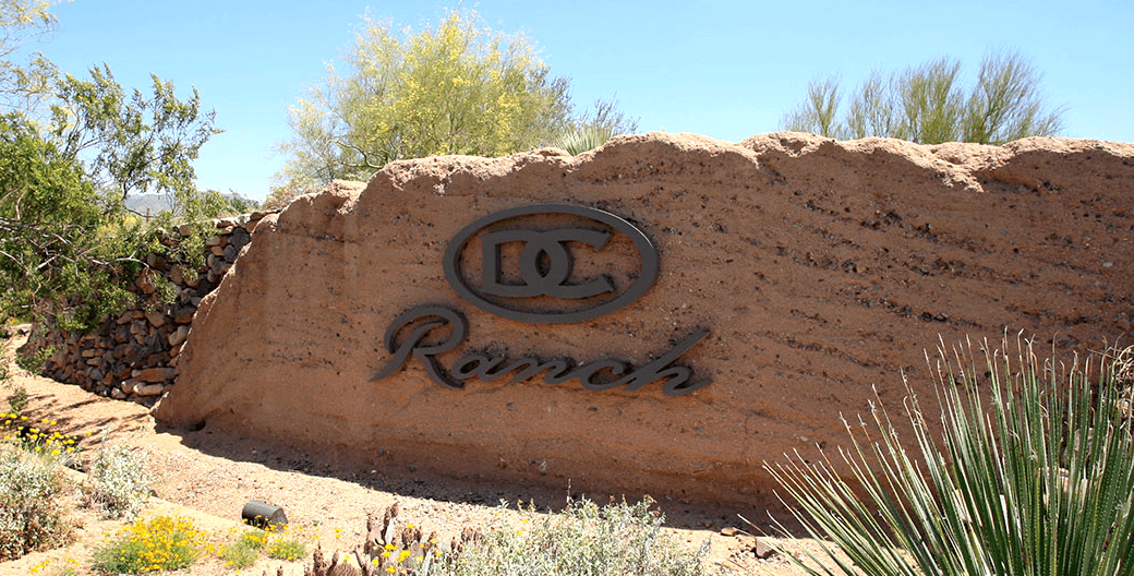 Stone entrance sign for DC Ranch community in North Scottsdale Arizona near Thompson Peak Parkway