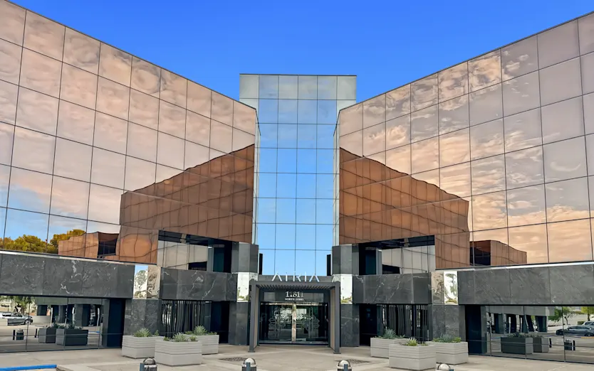 Modern office building near Tatum and Bell in North Phoenix, home to local small businesses with TLD USA.