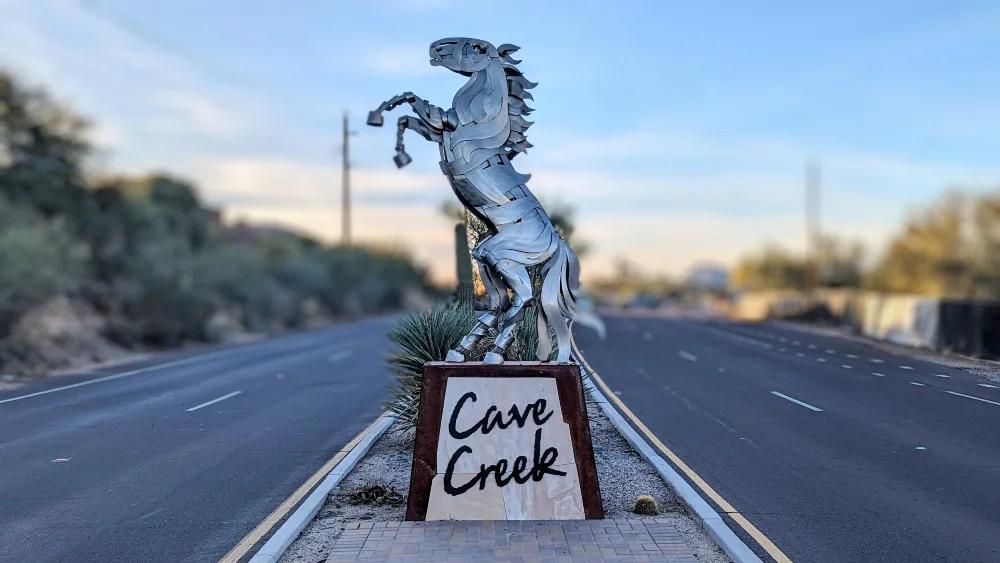Cave Creek web design and SEO for North Scottsdale businesses, desert mountains behind a laptop showing a website